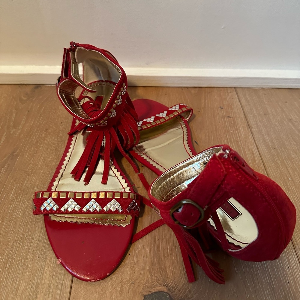 Red suede fringed ankle strap sandals